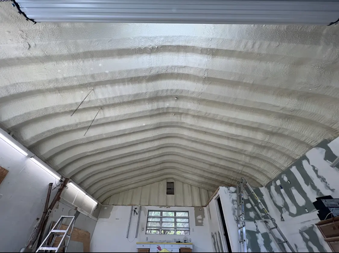 Spray polyurethane foam applied to the underside of a metal roof deck in Powell